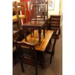 Jointed rectangular turned leg table and six wrought metal panel back dining chairs.