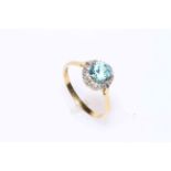 18 carat gold and platinum, aquamarine and diamond cluster ring.