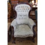 Victorian mahogany framed armchair in button backed fabric.