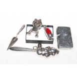 Five silver small items comprising pig pin cushion, bookmark, rattle, teddy bear and sovereign case.