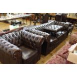 Brown buttoned leather four piece Chesterfield suite comprising three seater settee, wing armchair,