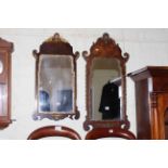 Two Georgian style walnut framed wall mirrors.