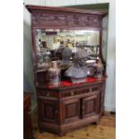 Early 20th Century oak mirror back sideboard with canted corners, 218cm by 156cm.