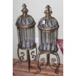 Pair of lanterns on stands.
