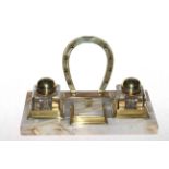 Jockey desk stand with jockey cap lidded inkwells and horseshoe pen rack.