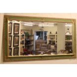 Rectangular gilt and green painted framed bevelled wall mirror.
