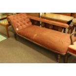 Edwardian walnut framed chaise longue on turned legs.