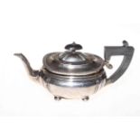 Silver teapot of oblong form on bun feet, Sheffield 1919.