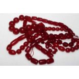 Three cherry amber coloured bead necklaces.