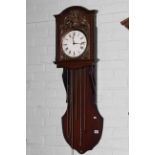 Mahogany cased triple weight wall clock with embossed brass dial.