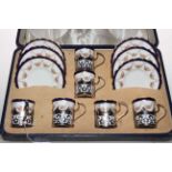 Cased set of silver mounted Aynsley coffee cups and saucers, decorated with flower garlands.