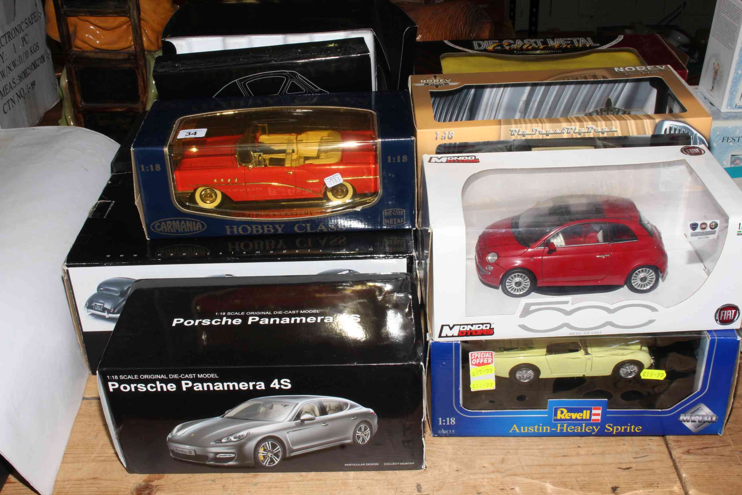 Collection of Diecast model cars in boxes including Revell, Neo, Solido, etc.