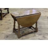 Good quality small oak drop leaf occasional table with swivel top.
