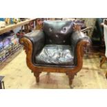 Regency/William IV armchair, having overscrolled arms and on reeded legs with leather upholstery.