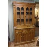 Pine side cabinet, with double glazed doors above three drawers and cupboards, 113cm wide,