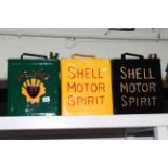 Three Shell petrol cans.