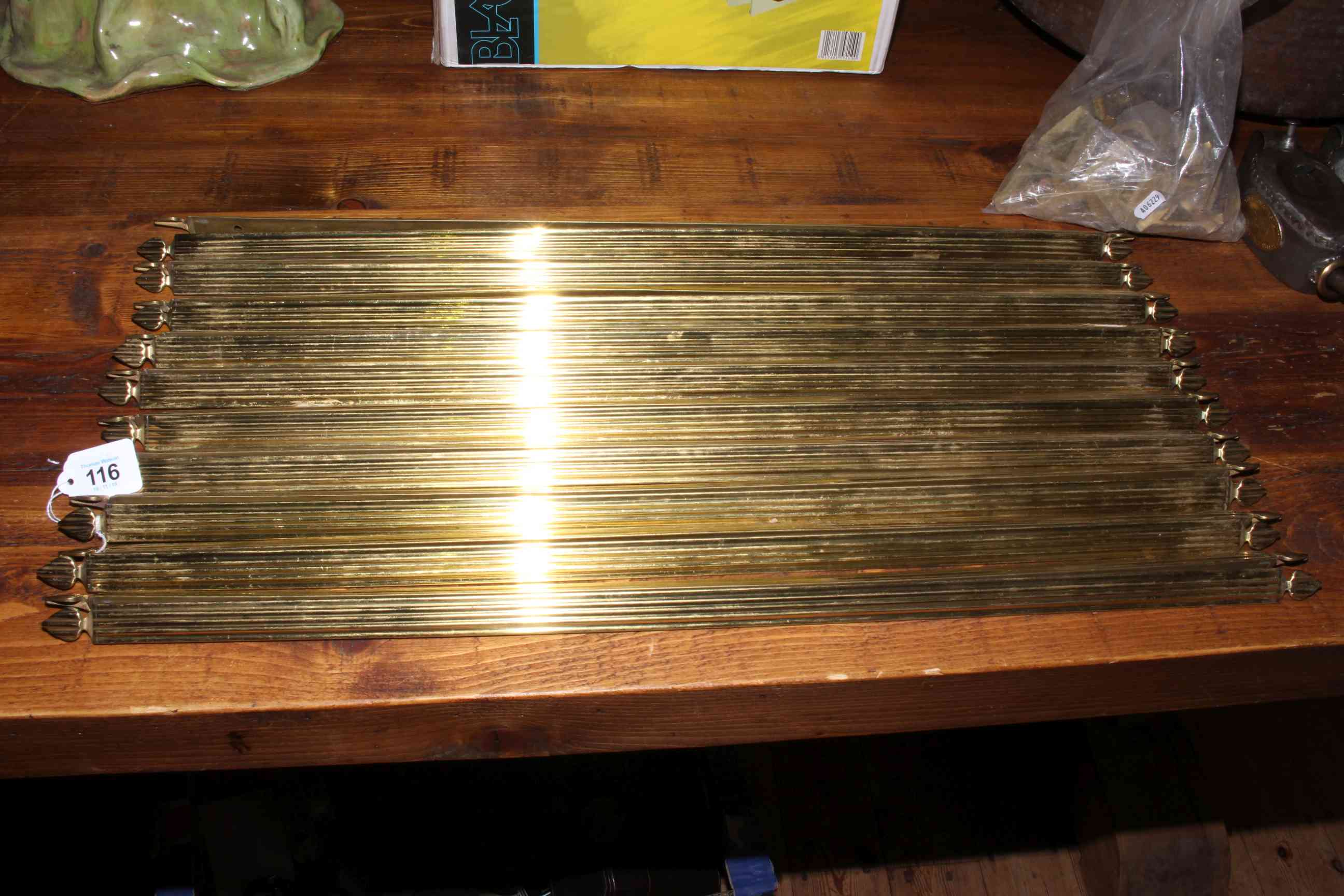 Collection of brass stair rods and fittings.