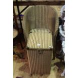 Gold Lloyd Loom chair and linen bin.