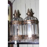 Pair of hanging glass and gilt metal hall lanterns with feet, 62cm.