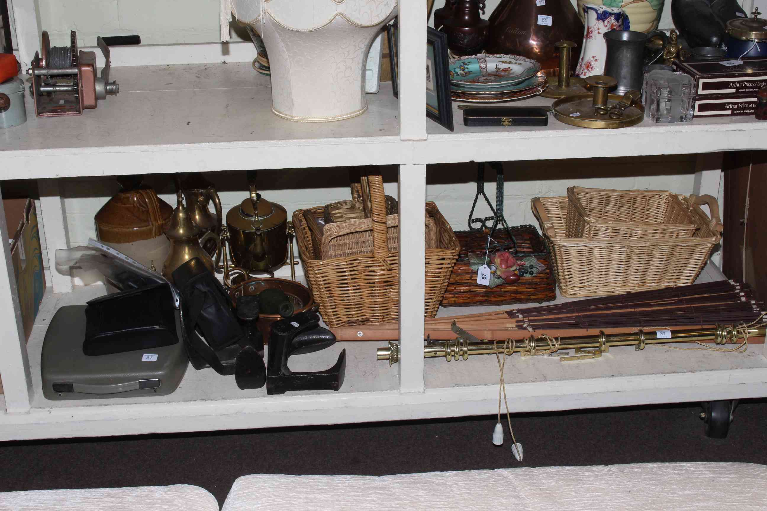 Collection of wicker baskets, binoculars, fan, metalwares, stone bottle, etc.