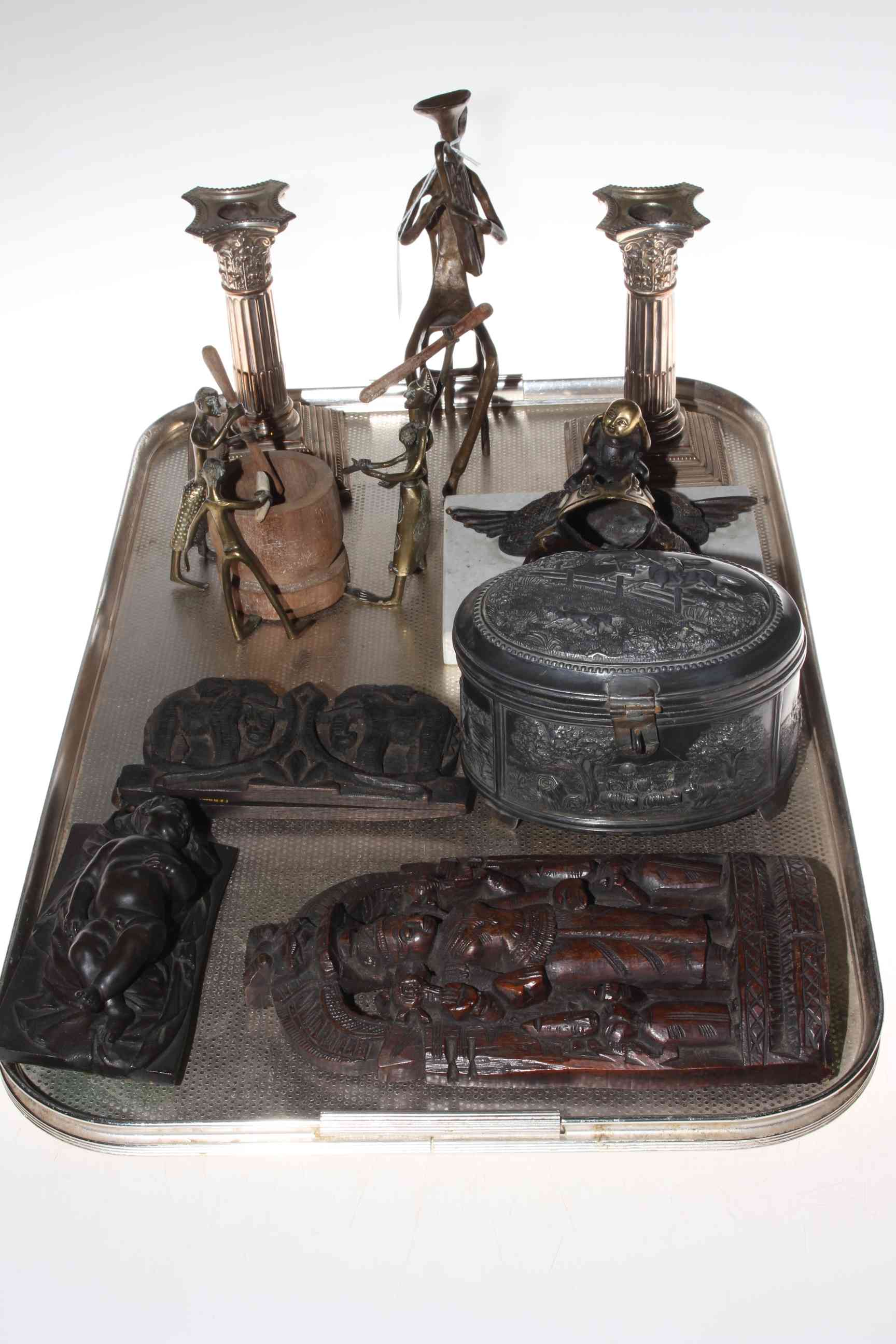 Pair of silver plated candlesticks, embossed tobacco box, frog desk stand, figures, carvings, etc.