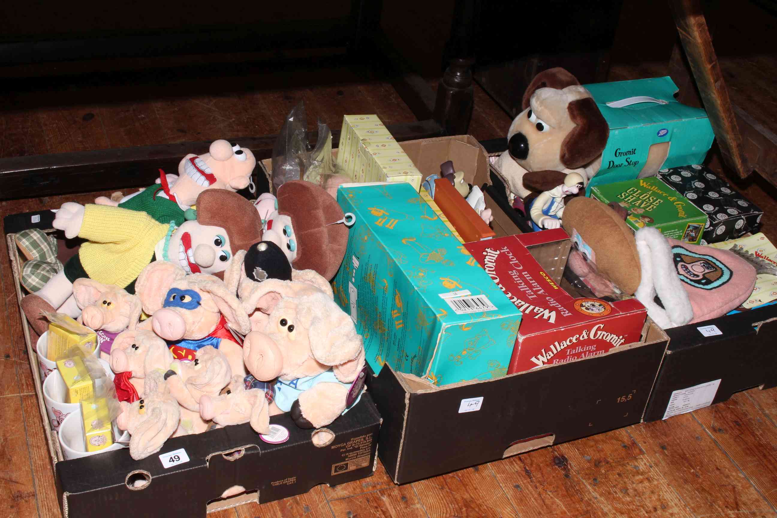 Three boxes of Wallace and Gromit collectables.