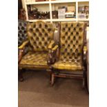 Two light green buttoned leather mahogany framed occasional armchairs.