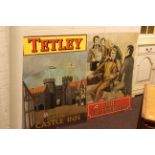 Two enamel signs 'The Commercial' and 'Tetley Castle Inn'.