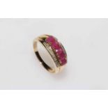 9 carat gold, ruby and diamond ring, having row of five rubies, size M.