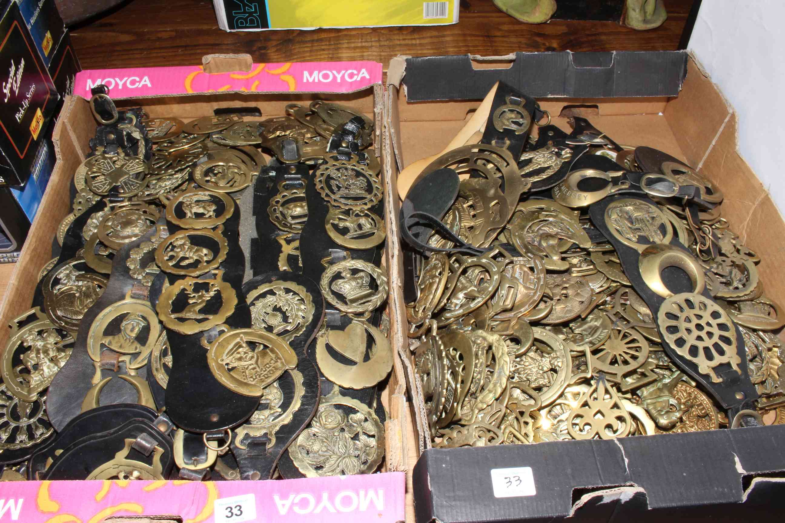 Two boxes of horse brasses.