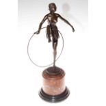 Bronze figure of a dancer with a hoop on marble plinth, 48cm.