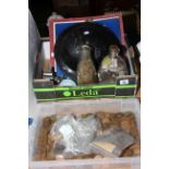 Two boxes of coins, car mascot badges, military helmet, tokens, etc.