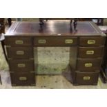 Military style mahogany pedestal desk with red leather top and inset brass handles, 121cm by 60cm.