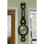 Inlaid mahogany wheel barometer and thermometer, with convex mirror.