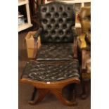 Mahogany framed dark green buttoned leather occasional armchair and matching footstool.