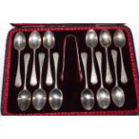 Cased set of twelve Victorian silver teaspoons and tongs, with engraved handles, London 1893.