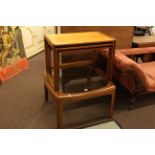 Glass top teak coffee table and nest of three teak tables.