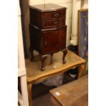 Walnut two drawer pot cupboard and oak bergere top coffee table.