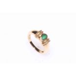 Emerald single stone ring set in yellow gold, boxed.