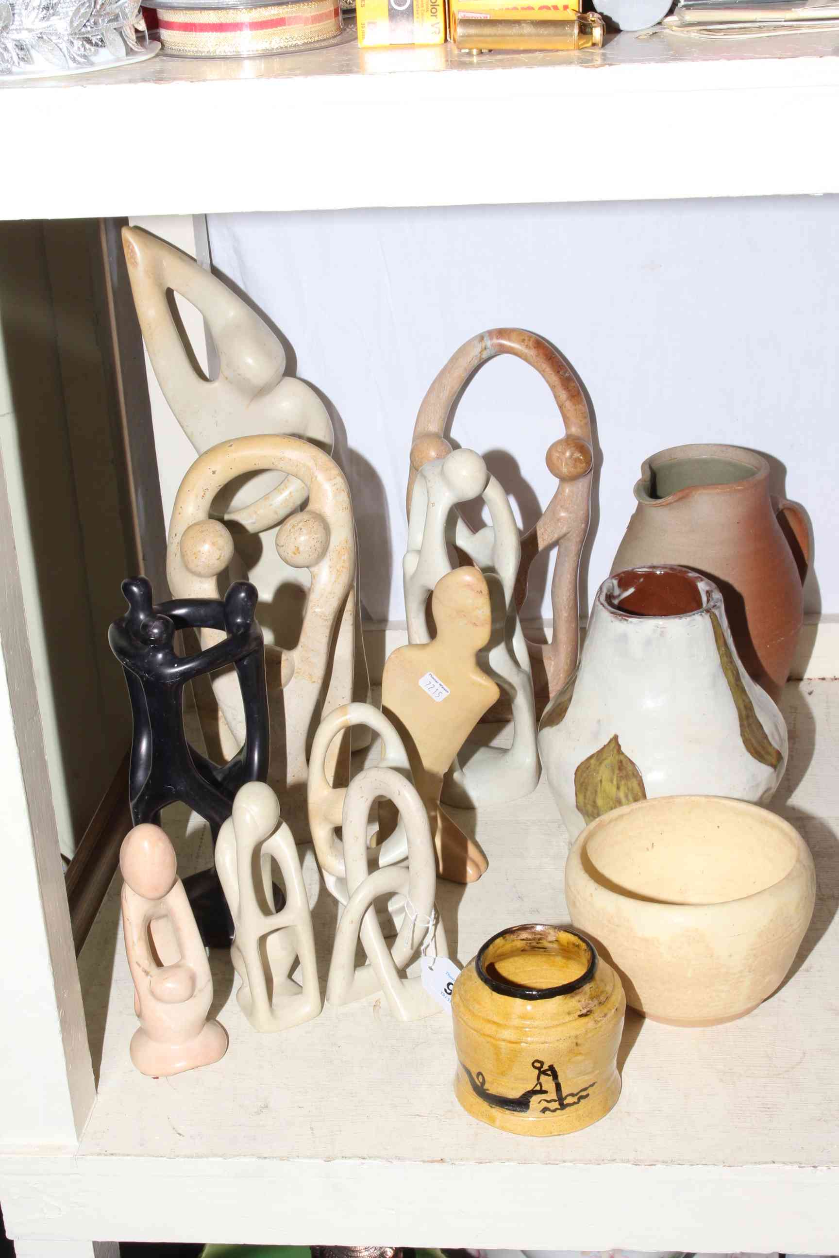 Four pieces of Studio Pottery and collection of soapstone sculptures.