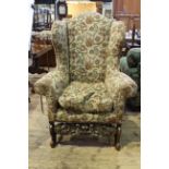 Gentleman's high back wing chair in tapestry upholstery,