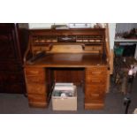 Oak twin pedestal roll top desk.