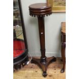 Early Victorian rosewood plant stand, having removable circular top with liner,