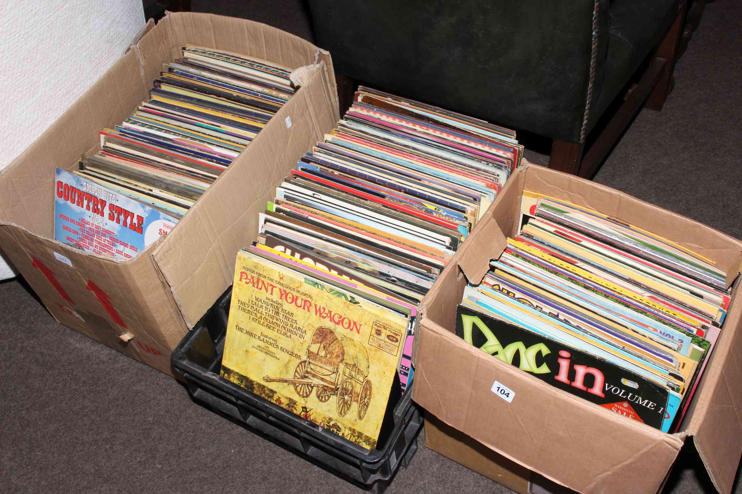 Three boxes of LP records.