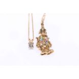 Gold set diamond pendant and gold clown pendant (2).