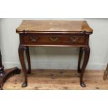 Antique fold top tea table, the shaped rectangular top above frieze drawer and on cabriole legs.