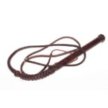 Leather plaited whip.