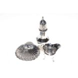 Silver octagonal caster, Birmingham 1910, shell shaped butter dish, Sheffield 1911 and cream jug,