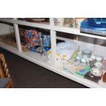 Large shelf collection of cameras, cutlery, binoculars, Nintendo and games, tea sets, light fitting,