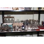 Nice collection of silver plated ware including desk calendar, tantalus with three decanters,